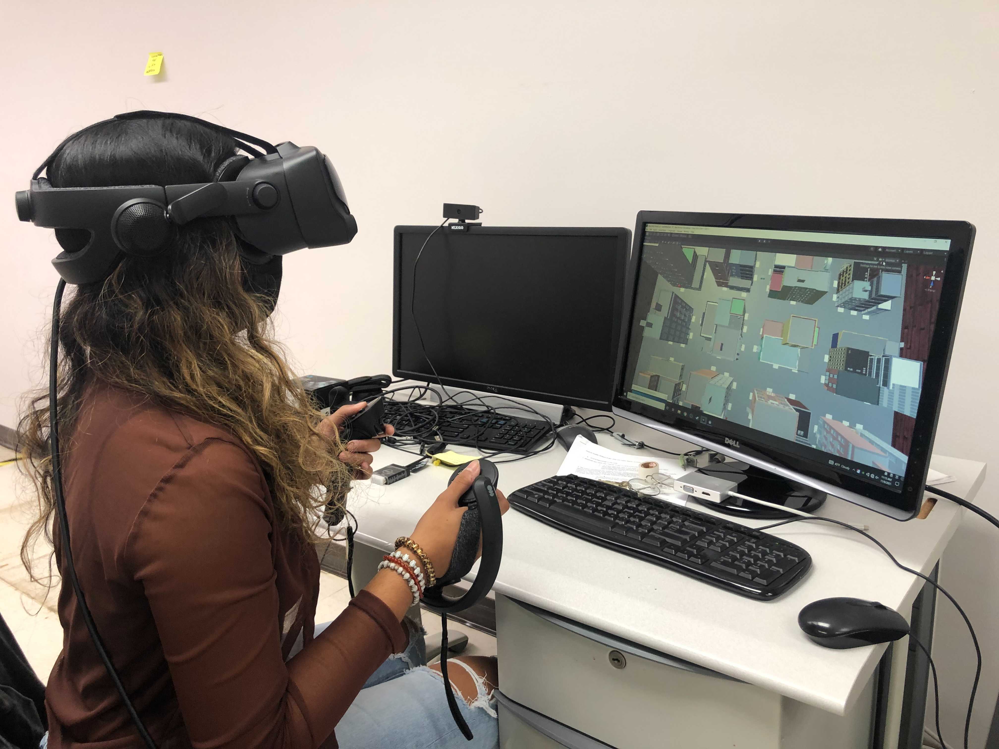 Anisha using VR equipment.