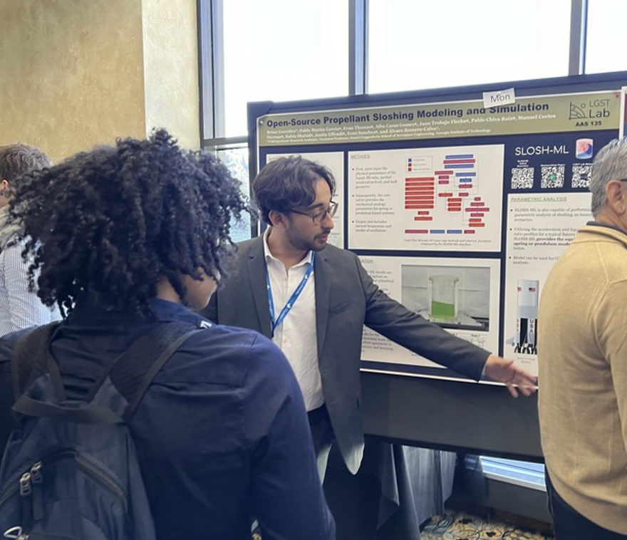 Brian presents his research at a poster session.