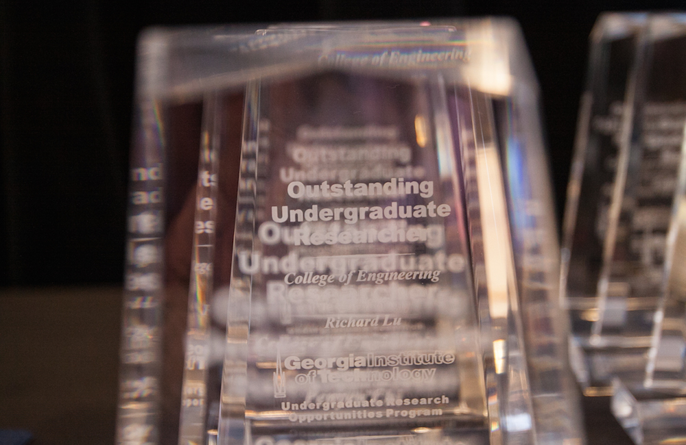 Outstanding Undergraduate Researcher trophies lined up.