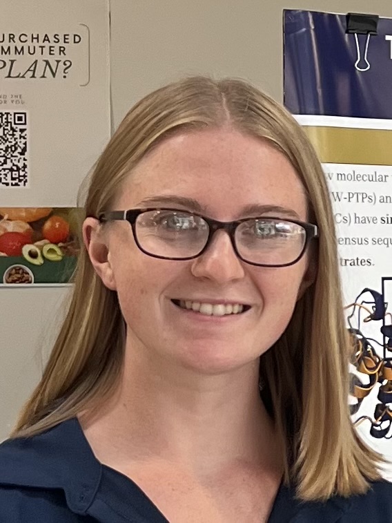 Sara smiles at the camera.