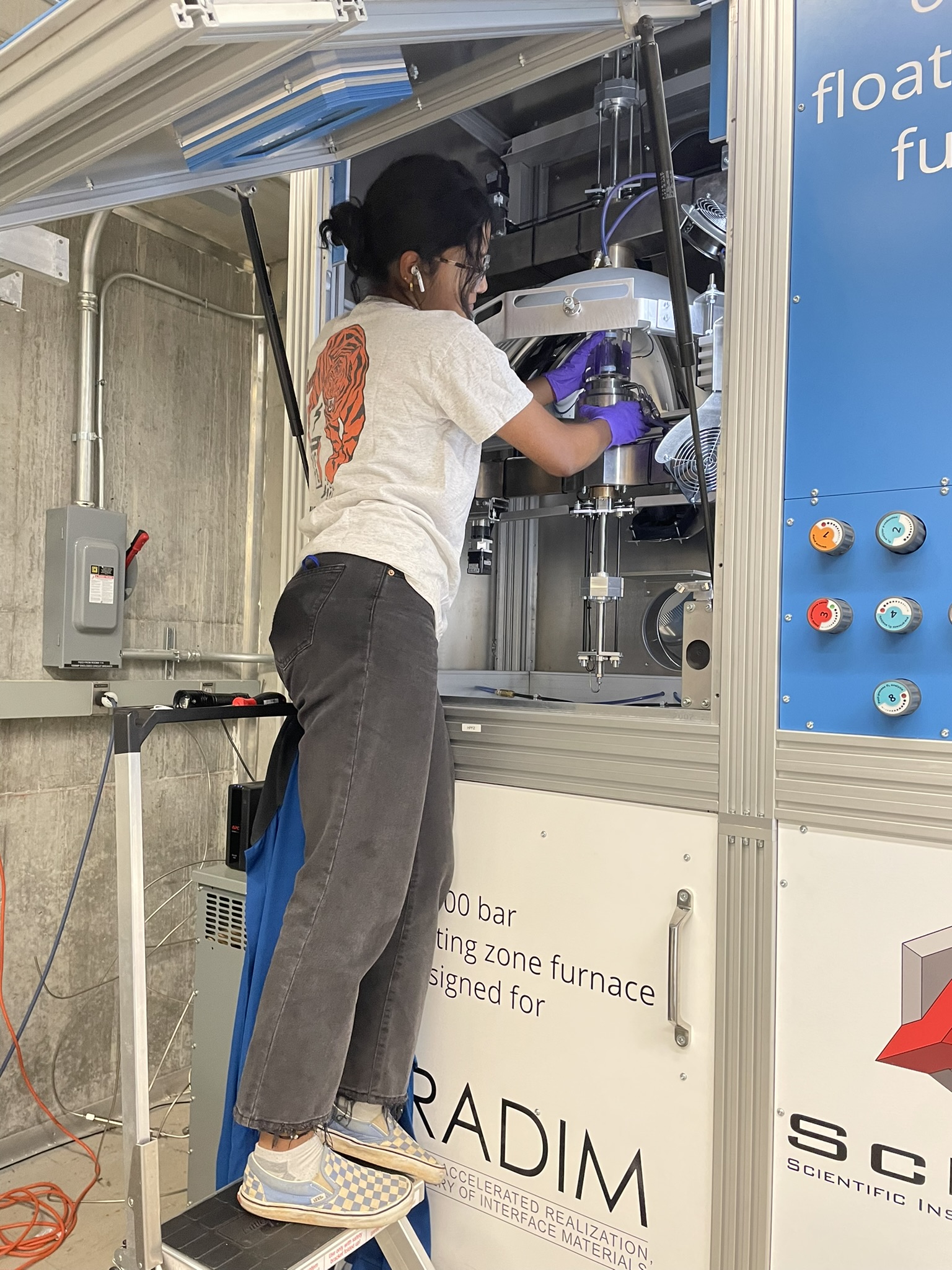 Shreenithi works on machinery in her lab.