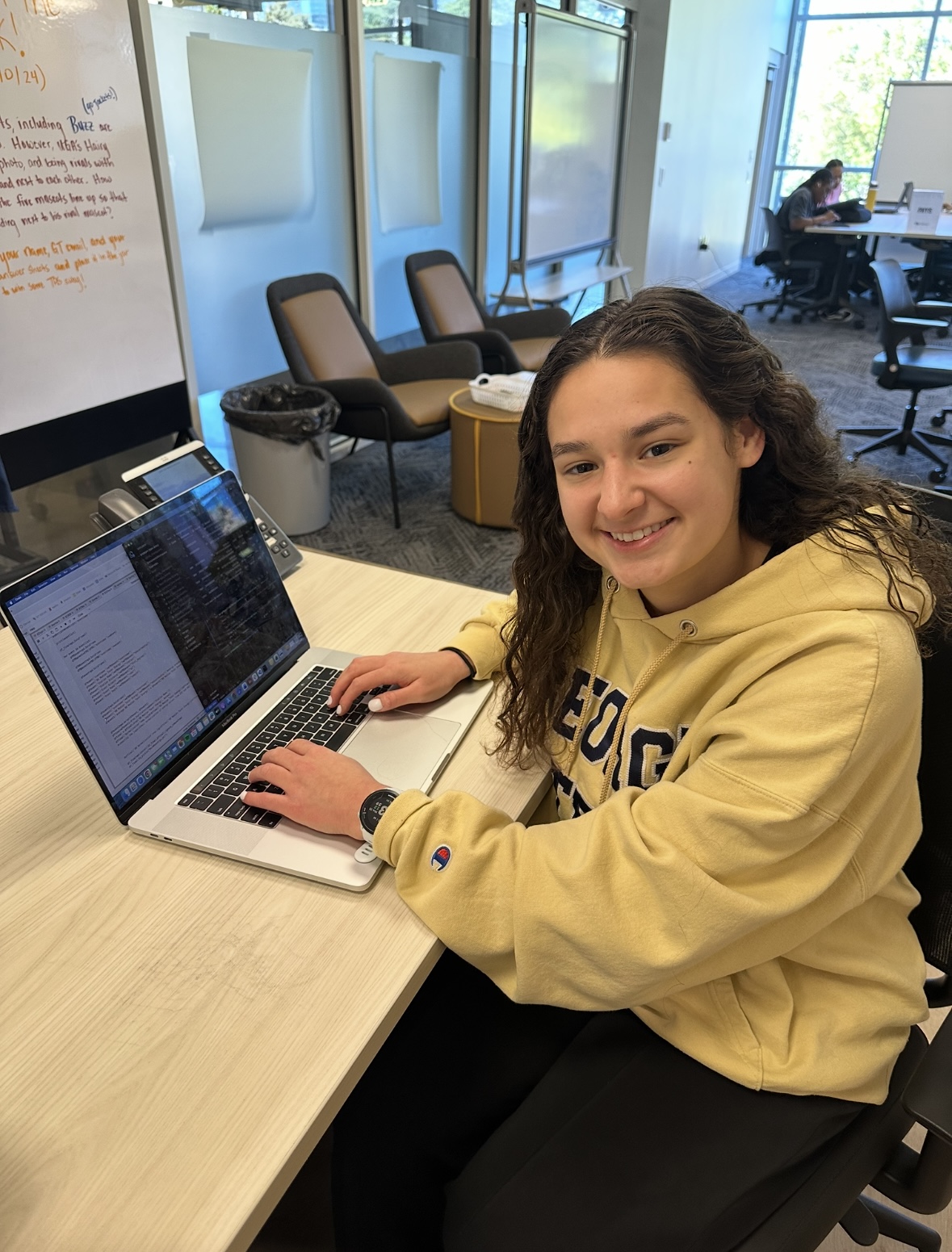 Elianna works on her laptop.
