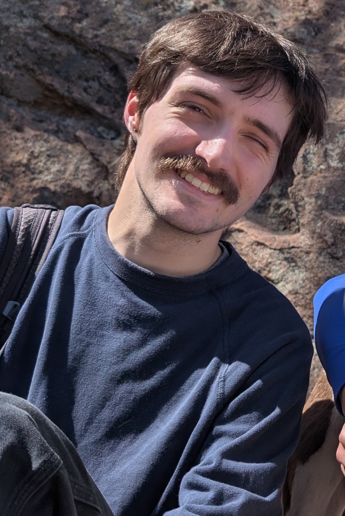 Brian smiles at the camera